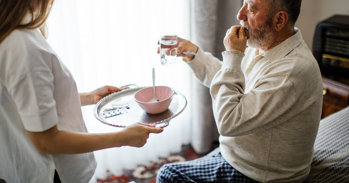 Elderly-eating-meds-and-a-caregiver-caregiver-expectations